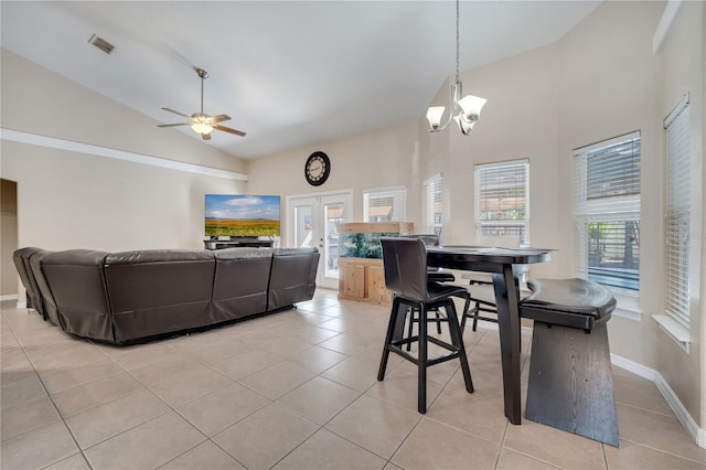 3211 Countryside View Dr, Saint Cloud, FL 34772 - dining area featuring a ceiling fan, light tile patterned floors, high vaulted ceiling, a chandelier, and baseboards