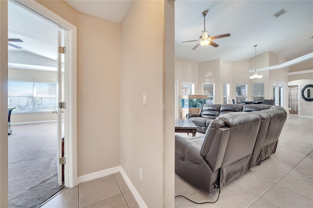 3211 Countryside View Dr, Saint Cloud, FL 34772 - living area featuring ceiling fan, light tile patterned floors, a chandelier, baseboards, and high vaulted ceiling