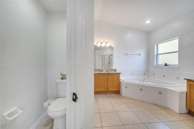 3211 Countryside View Dr, Saint Cloud, FL 34772 - bathroom featuring toilet, a stall shower, a garden tub, tile patterned floors, and vanity