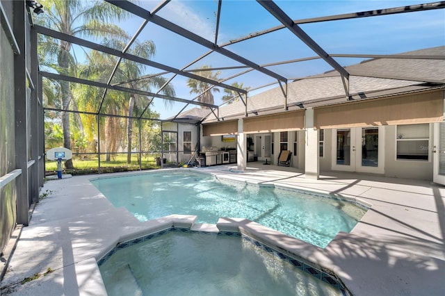 3211 Countryside View Dr, Saint Cloud, FL 34772 - view of swimming pool featuring a patio area, a pool with connected hot tub, a lanai, and french doors