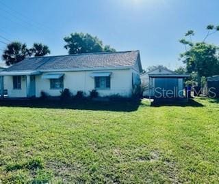 1309 N Thacker Ave, Kissimmee, FL 34741 - view of front of property with a front yard