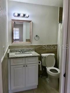1309 N Thacker Ave, Kissimmee, FL 34741 - full bathroom with toilet and vanity