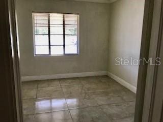 1309 N Thacker Ave, Kissimmee, FL 34741 - spare room with baseboards
