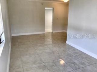 1309 N Thacker Ave, Kissimmee, FL 34741 - spare room featuring baseboards
