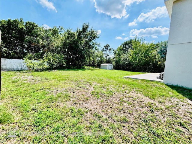 467 Martigues Dr, Kissimmee, FL 34759 - view of yard featuring a shed, an outdoor structure, and a patio