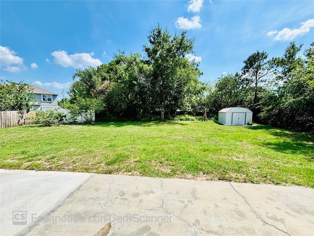 467 Martigues Dr, Kissimmee, FL 34759 - view of yard with a storage unit and an outbuilding