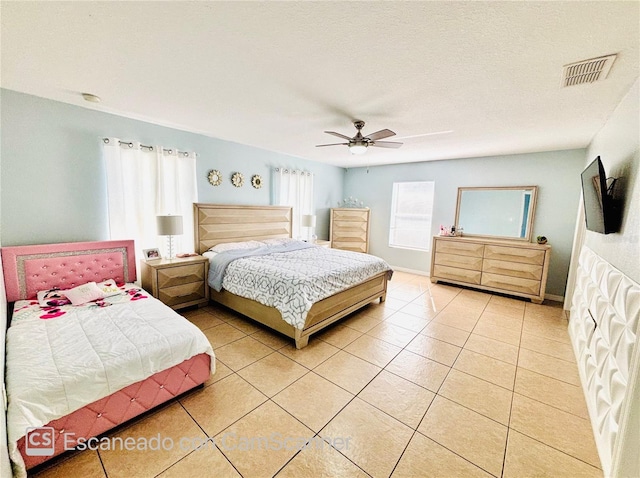 467 Martigues Dr, Kissimmee, FL 34759 - bedroom featuring light tile patterned floors, ceiling fan, and baseboards