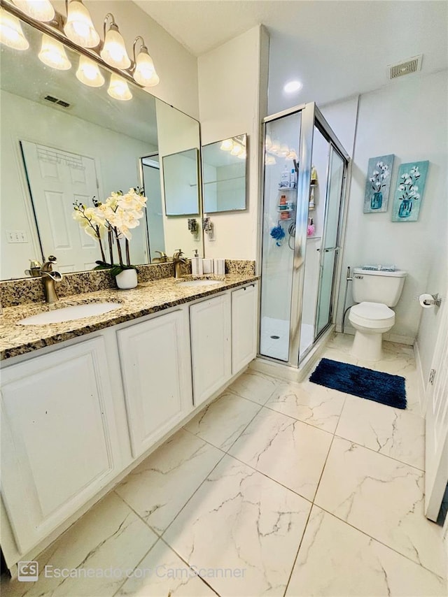 467 Martigues Dr, Kissimmee, FL 34759 - bathroom featuring toilet, double vanity, a stall shower, and marble look tiles