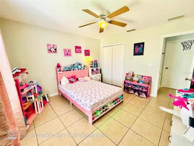 467 Martigues Dr, Kissimmee, FL 34759 - bedroom featuring a closet, light tile patterned flooring, and a ceiling fan