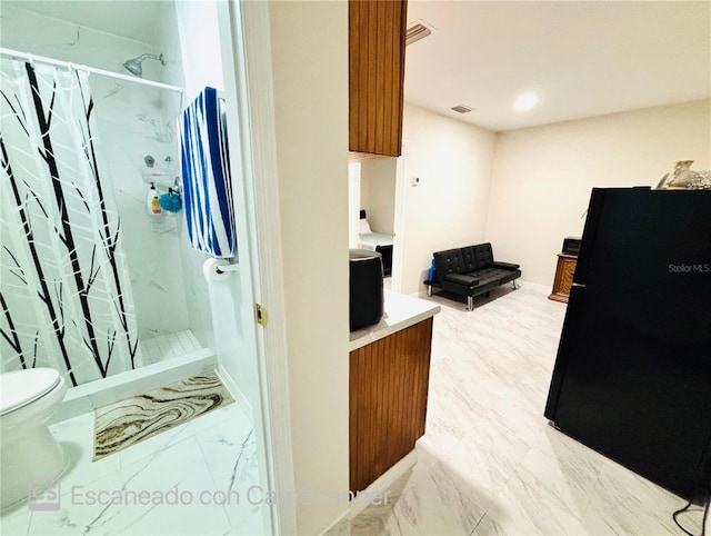 467 Martigues Dr, Kissimmee, FL 34759 - bathroom featuring a stall shower, toilet, marble finish floors, vanity, and recessed lighting