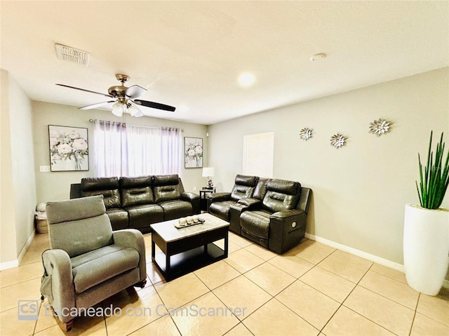 467 Martigues Dr, Kissimmee, FL 34759 - living room featuring light tile patterned flooring, baseboards, and a ceiling fan