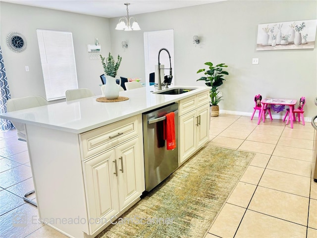 467 Martigues Dr, Kissimmee, FL 34759 - kitchen featuring stainless steel dishwasher, a sink, light countertops, light tile patterned flooring, and a chandelier