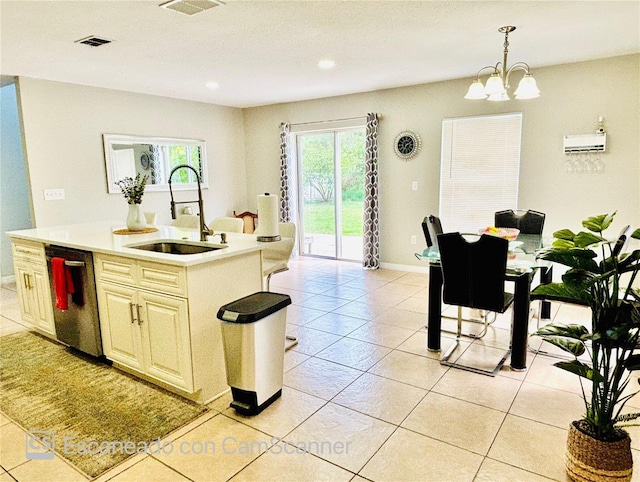 467 Martigues Dr, Kissimmee, FL 34759 - kitchen with a sink, dishwashing machine, light countertops, an island with sink, and light tile patterned flooring