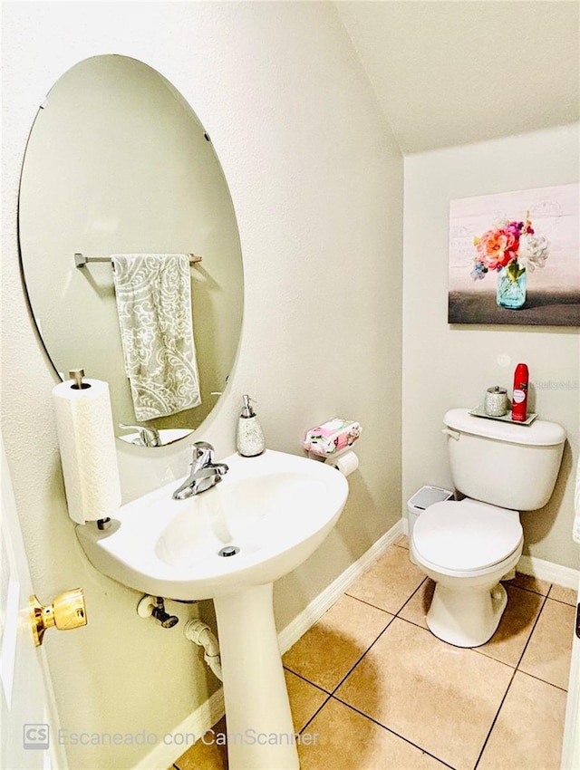 467 Martigues Dr, Kissimmee, FL 34759 - half bath with tile patterned flooring, toilet, and baseboards