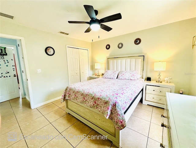 467 Martigues Dr, Kissimmee, FL 34759 - bedroom featuring a closet, light tile patterned floors, baseboards, and a ceiling fan