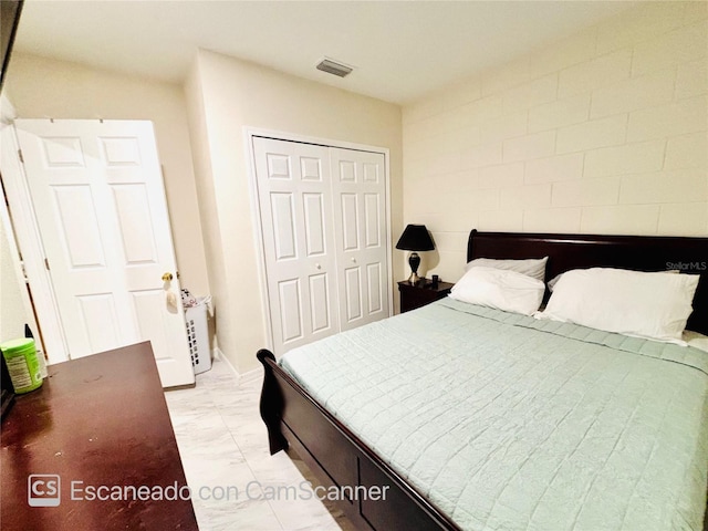 467 Martigues Dr, Kissimmee, FL 34759 - bedroom featuring light marble finish floors and a closet