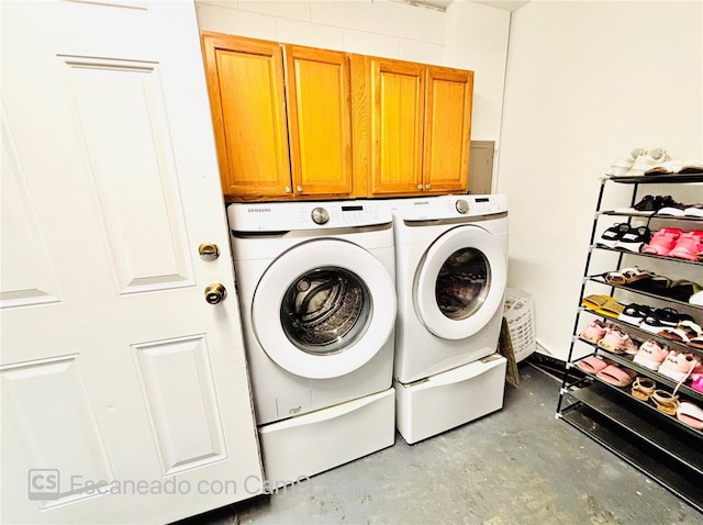 467 Martigues Dr, Kissimmee, FL 34759 - clothes washing area featuring washing machine and clothes dryer and cabinet space
