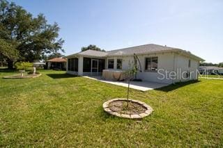 10237 SW 63rd Ave, Ocala, FL 34476 - back of house featuring a lawn
