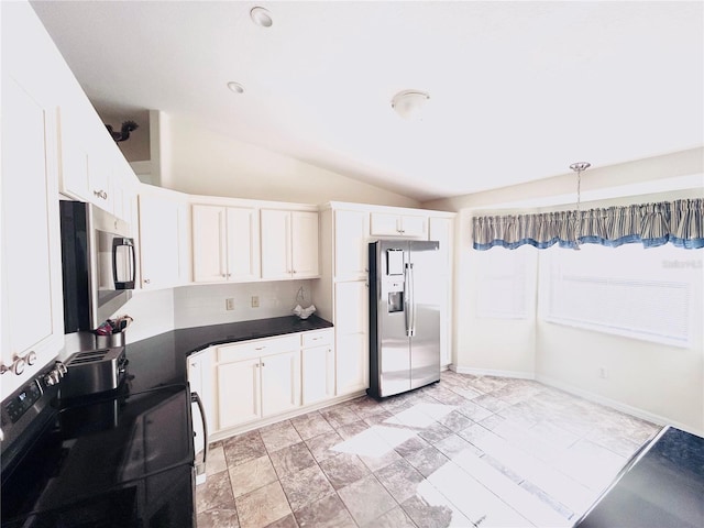10237 SW 63rd Ave, Ocala, FL 34476 - kitchen featuring appliances with stainless steel finishes, dark countertops, lofted ceiling, white cabinets, and pendant lighting