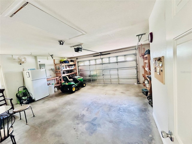 10237 SW 63rd Ave, Ocala, FL 34476 - garage with freestanding refrigerator and a garage door opener