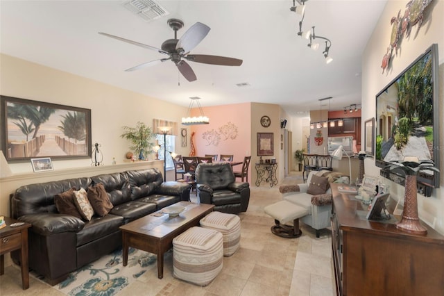 7521 Pellham Way, Kissimmee, FL 34747 - living room with a ceiling fan, a chandelier, and light tile patterned floors