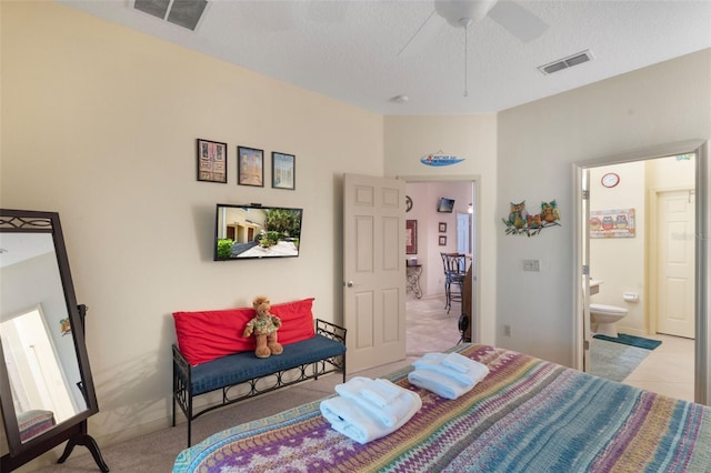 7521 Pellham Way, Kissimmee, FL 34747 - bedroom featuring ensuite bath, a textured ceiling, carpet, and ceiling fan