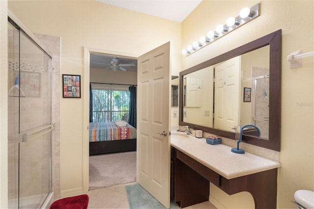 7521 Pellham Way, Kissimmee, FL 34747 - bathroom featuring ensuite bathroom, ceiling fan, tile patterned flooring, a shower stall, and vanity
