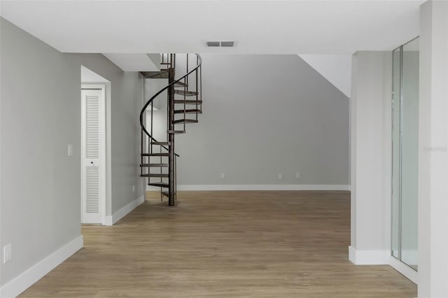 5151 Puritan Cir Unit 1022, Tampa, FL 33617 - stairs with wood finished floors and baseboards