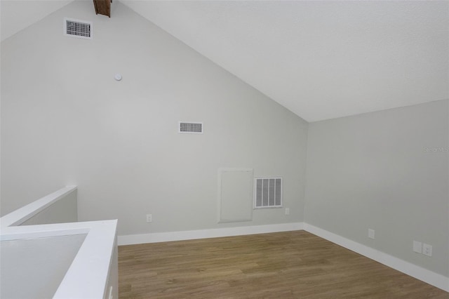 5151 Puritan Cir Unit 1022, Tampa, FL 33617 - additional living space featuring vaulted ceiling, wood finished floors, and baseboards