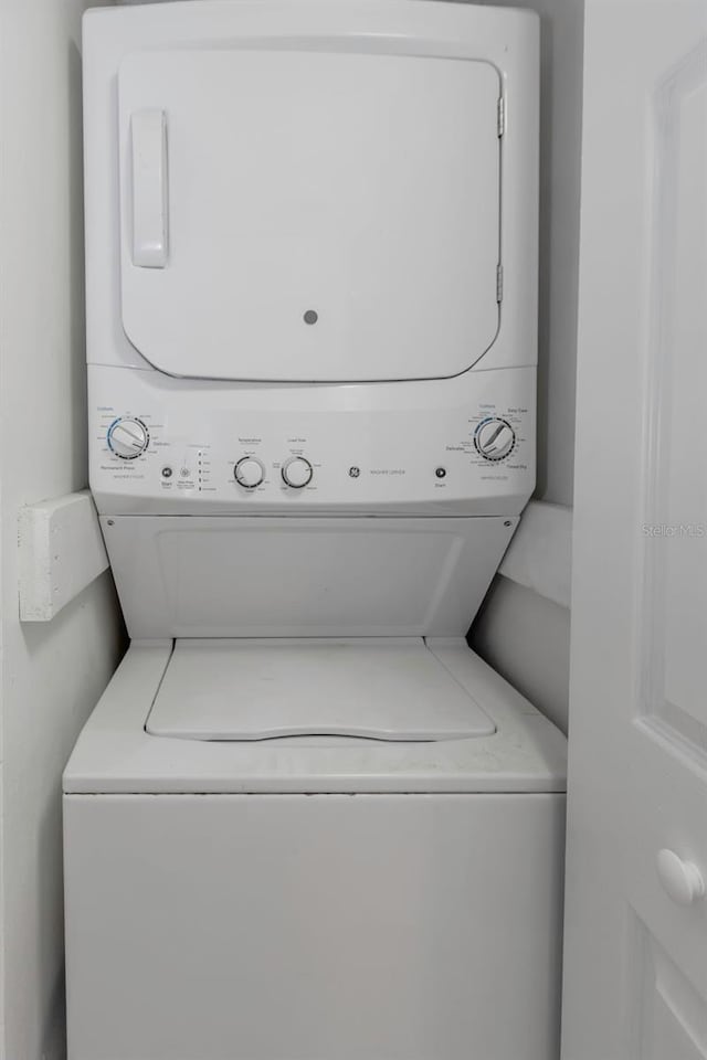5151 Puritan Cir Unit 1022, Tampa, FL 33617 - washroom featuring stacked washer and clothes dryer