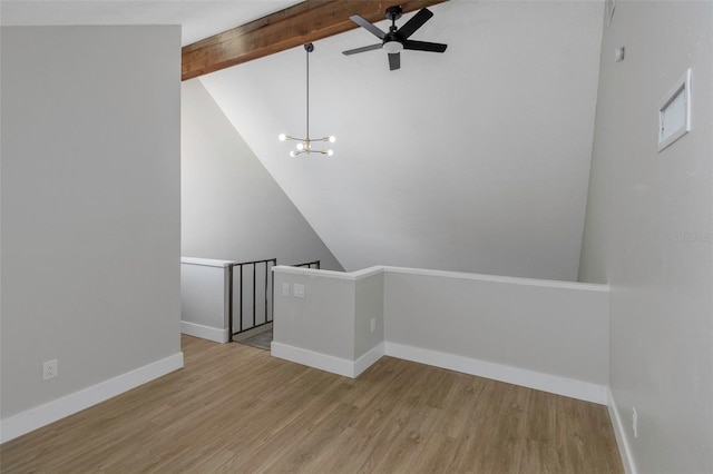 5151 Puritan Cir Unit 1022, Tampa, FL 33617 - empty room featuring ceiling fan, wood finished floors, baseboards, and a chandelier