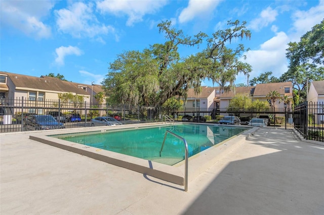 5151 Puritan Cir Unit 1022, Tampa, FL 33617 - community pool featuring a residential view and a patio area