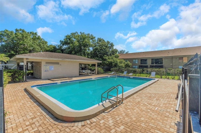 5151 Puritan Cir Unit 1022, Tampa, FL 33617 - community pool featuring a patio area