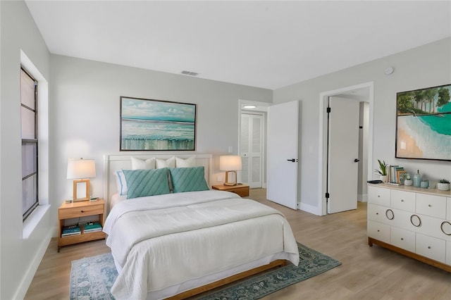 5151 Puritan Cir Unit 1022, Tampa, FL 33617 - bedroom with light wood finished floors and baseboards