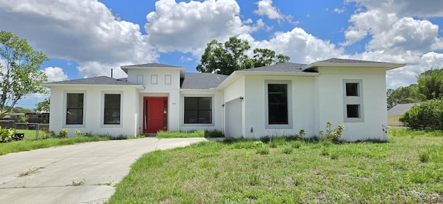 prairie-style home with stucco siding
