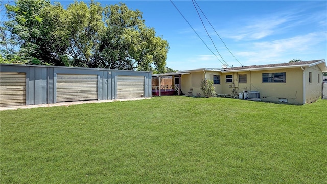 4218 Drexel Ave, Orlando, FL 32808 - view of green lawn with an outdoor structure and a detached garage