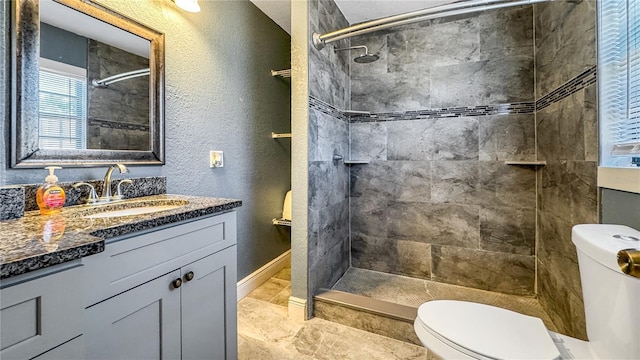 4218 Drexel Ave, Orlando, FL 32808 - bathroom featuring vanity, tiled shower, and a textured wall