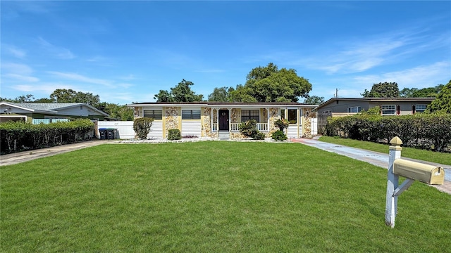 4218 Drexel Ave, Orlando, FL 32808 - single story home with a porch and stone siding