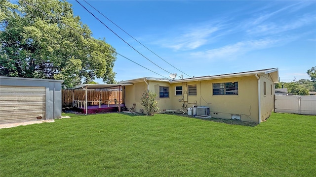 4218 Drexel Ave, Orlando, FL 32808 - rear view of property with a fenced backyard, stucco siding, crawl space, and a garage
