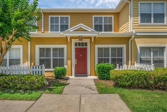 2614 Lodi Cir Unit 106, Kissimmee, FL 34746 - entrance to property with stucco siding and fence