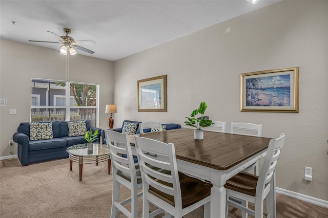 2614 Lodi Cir Unit 106, Kissimmee, FL 34746 - carpeted dining space featuring ceiling fan and baseboards