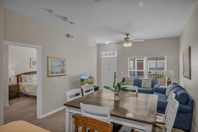 2614 Lodi Cir Unit 106, Kissimmee, FL 34746 - dining area featuring carpet flooring, ceiling fan, and baseboards