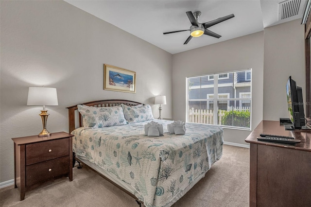 2614 Lodi Cir Unit 106, Kissimmee, FL 34746 - bedroom featuring light carpet, baseboards, and a ceiling fan