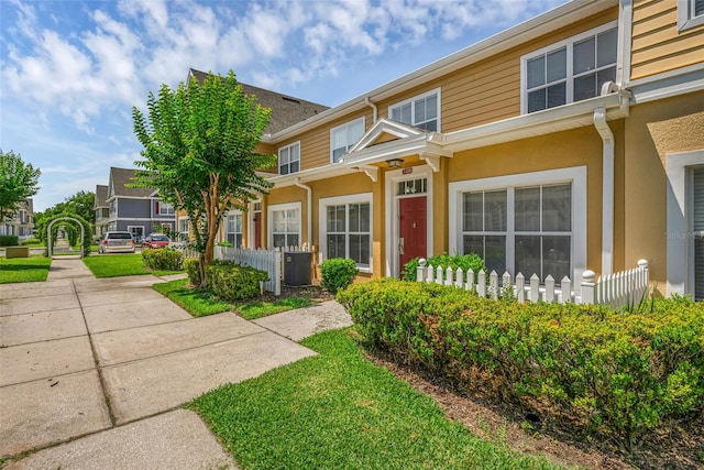 2614 Lodi Cir Unit 106, Kissimmee, FL 34746 - townhome / multi-family property featuring stucco siding and central AC unit