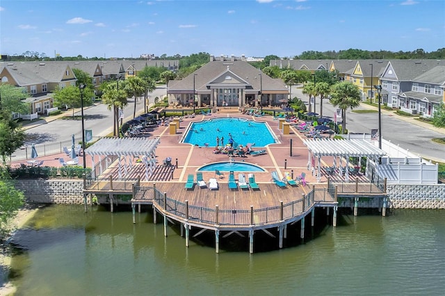 2614 Lodi Cir Unit 106, Kissimmee, FL 34746 - aerial perspective of suburban area featuring a pool area and a large body of water