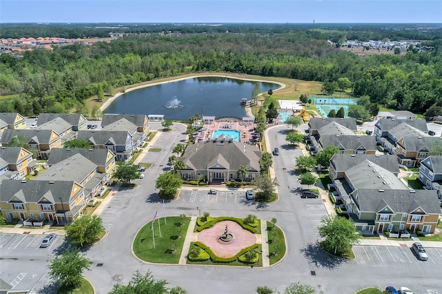 2614 Lodi Cir Unit 106, Kissimmee, FL 34746 - aerial overview of property's location featuring a nearby body of water, nearby suburban area, and a heavily wooded area