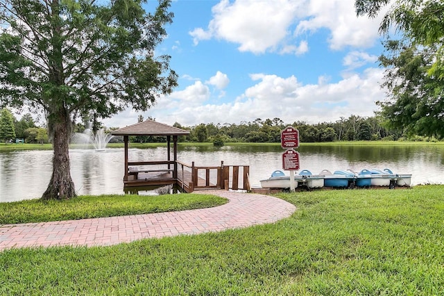 2614 Lodi Cir Unit 106, Kissimmee, FL 34746 - dock with a gazebo, a lawn, and a water view