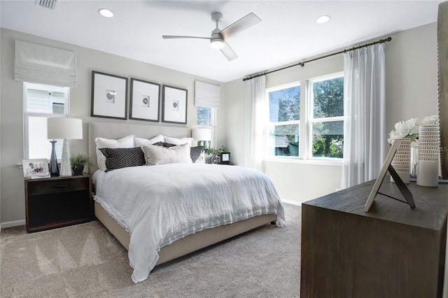 bedroom featuring light colored carpet, baseboards, a ceiling fan, and recessed lighting
