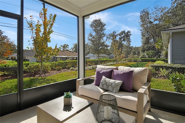 sunroom featuring an outdoor hangout area