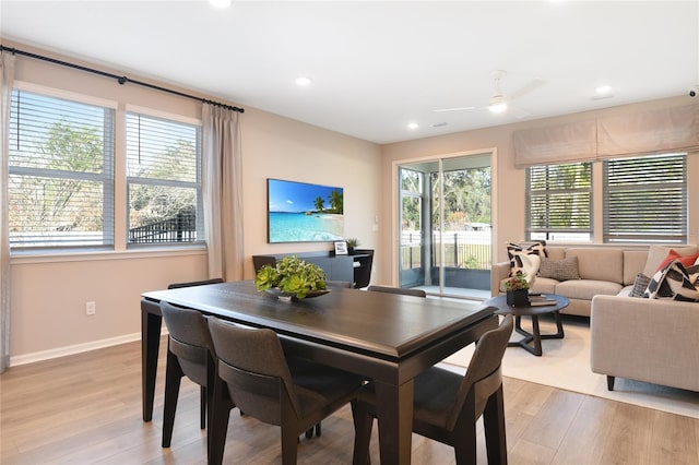 dining space with healthy amount of natural light, light wood-type flooring, ceiling fan, recessed lighting, and baseboards